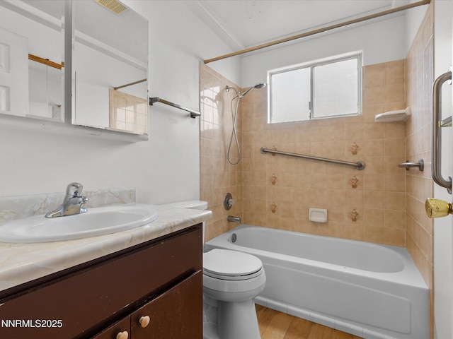 1344 Patricia Dr, Gardnerville, NV 89460 - full bathroom with toilet, vanity, shower / washtub combination, and wood finished floors