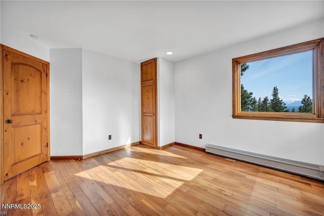 517 Driver Way, Incline Village, NV 89451 - unfurnished room with light wood-type flooring, a baseboard heating unit, and recessed lighting