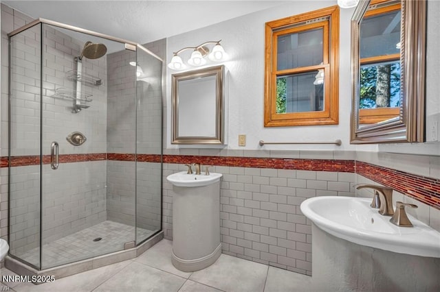 517 Driver Way, Incline Village, NV 89451 - full bath with a stall shower, tile patterned floors, a wainscoted wall, and tile walls