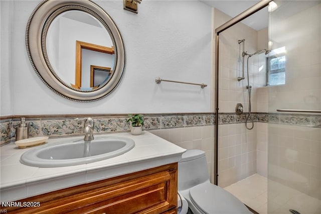 517 Driver Way, Incline Village, NV 89451 - bathroom featuring a tile shower, vanity, wainscoting, and tile walls