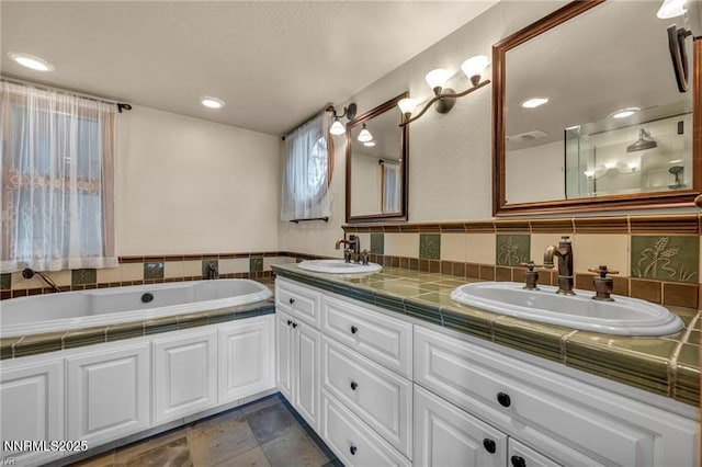 517 Driver Way, Incline Village, NV 89451 - bathroom featuring double vanity, a garden tub, and backsplash