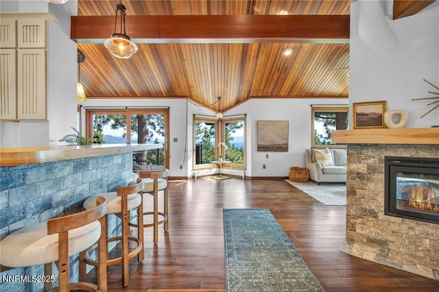517 Driver Way, Incline Village, NV 89451 - living room featuring wooden ceiling, healthy amount of natural light, a glass covered fireplace, and dark wood-type flooring