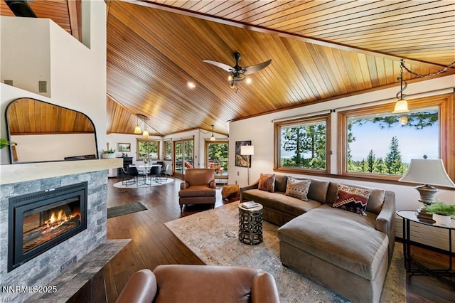 517 Driver Way, Incline Village, NV 89451 - living room with wooden ceiling, vaulted ceiling, ceiling fan, a tiled fireplace, and dark wood-style flooring