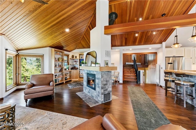 517 Driver Way, Incline Village, NV 89451 - living room with dark wood-style floors, a tile fireplace, wooden ceiling, stairway, and high vaulted ceiling
