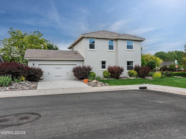 1105 Fiore Ct, Minden, NV 89423 - view of front facade with stucco siding, an attached garage, and concrete driveway