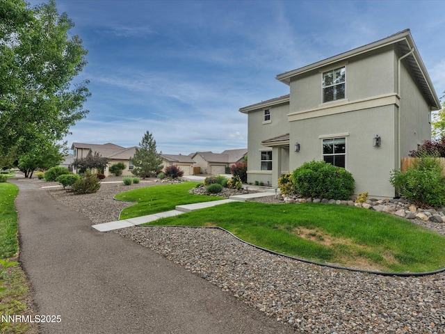 1105 Fiore Ct, Minden, NV 89423 - rear view of property featuring a yard and stucco siding