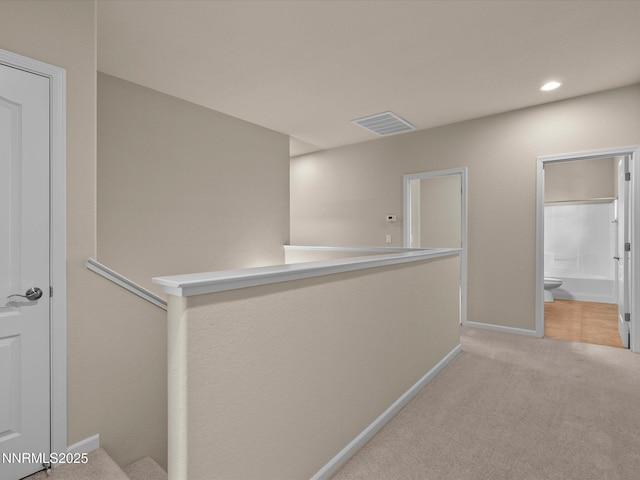 1105 Fiore Ct, Minden, NV 89423 - hallway with light colored carpet, baseboards, and recessed lighting