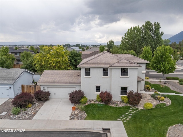 1105 Fiore Ct, Minden, NV 89423 - view of front of property featuring an attached garage, concrete driveway, stucco siding, and a tile roof