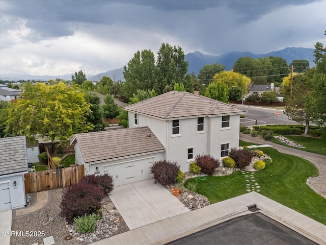 1105 Fiore Ct, Minden, NV 89423 - view of property exterior featuring stucco siding, a tile roof, an attached garage, and driveway