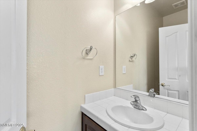 1239 Flintwood Dr, Carson City, NV 89703 - bathroom with vanity and a textured wall