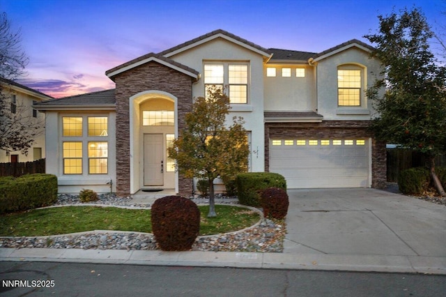 1239 Flintwood Dr, Carson City, NV 89703 - traditional-style house with concrete driveway, a garage, stucco siding, stone siding, and a tile roof
