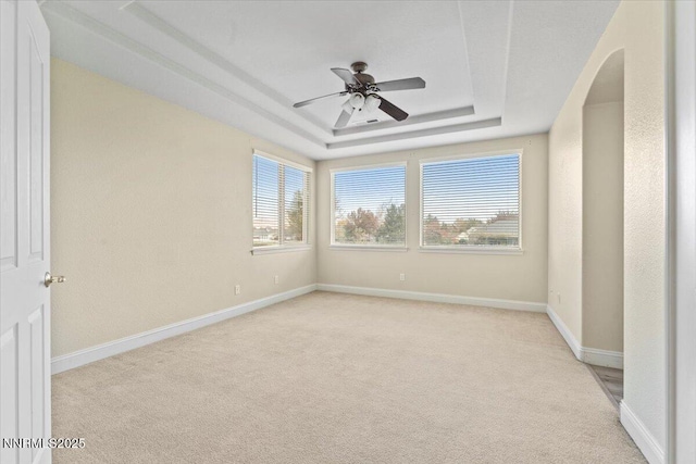 1239 Flintwood Dr, Carson City, NV 89703 - unfurnished room featuring a raised ceiling, a ceiling fan, light carpet, and baseboards