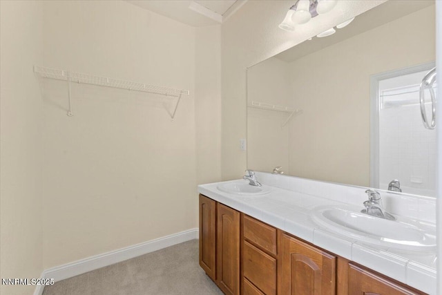 1239 Flintwood Dr, Carson City, NV 89703 - full bath featuring double vanity, a walk in closet, and baseboards