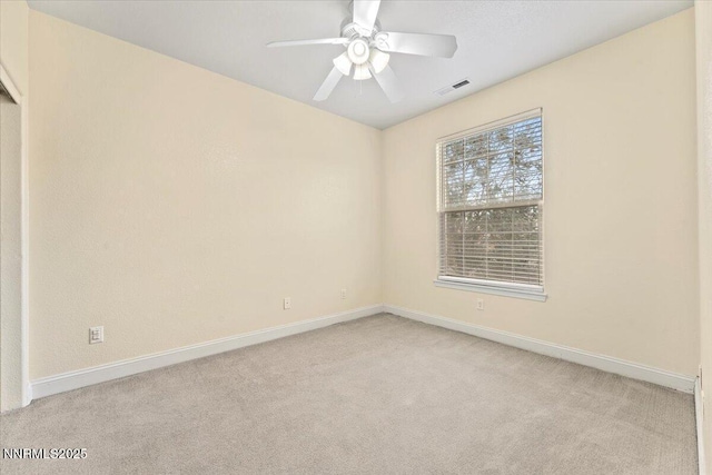 1239 Flintwood Dr, Carson City, NV 89703 - spare room featuring light carpet, baseboards, and a ceiling fan