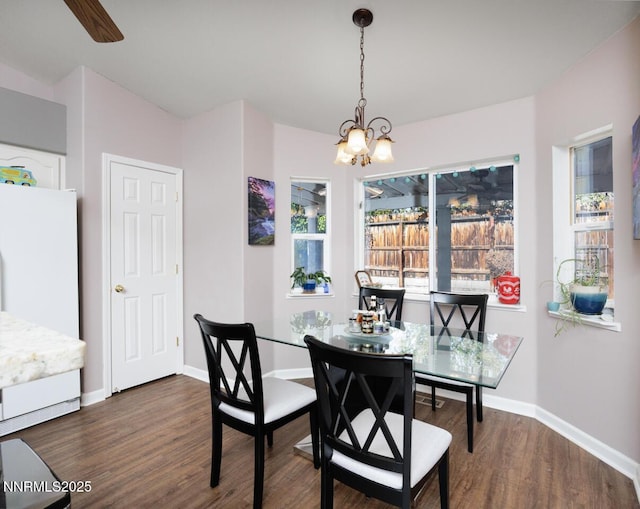 791 Noel Ln, Fallon, NV 89406 - dining space with a chandelier, dark wood-type flooring, and baseboards