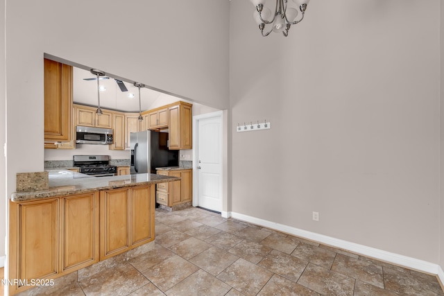 1220 Conway Ln, Reno, NV 89503 - kitchen featuring stainless steel appliances, light stone countertops, a chandelier, a high ceiling, and a peninsula