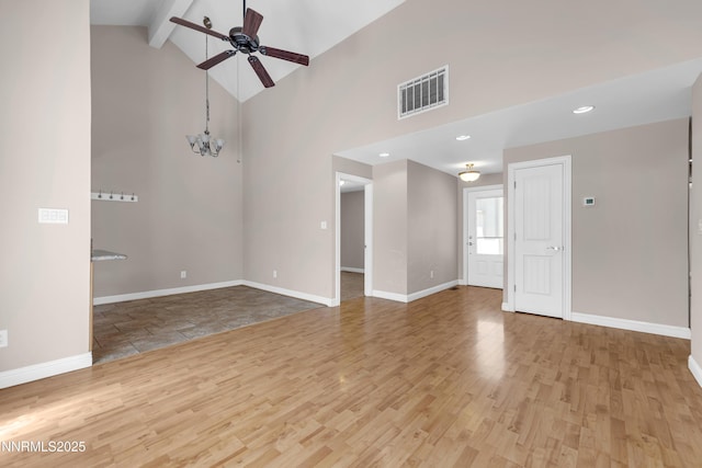 1220 Conway Ln, Reno, NV 89503 - unfurnished room featuring a ceiling fan, beamed ceiling, wood finished floors, a chandelier, and high vaulted ceiling