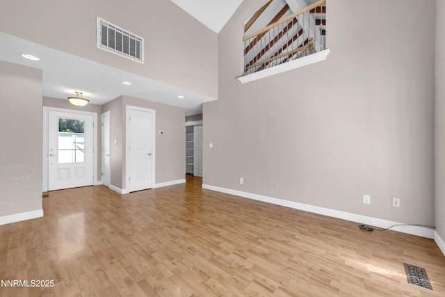 1220 Conway Ln, Reno, NV 89503 - unfurnished living room featuring light wood finished floors and recessed lighting