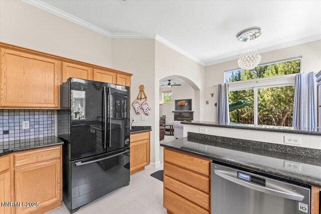 1328 Windridge Dr, Carson City, NV 89706 - kitchen featuring freestanding refrigerator, dishwasher, healthy amount of natural light, tasteful backsplash, and ornamental molding