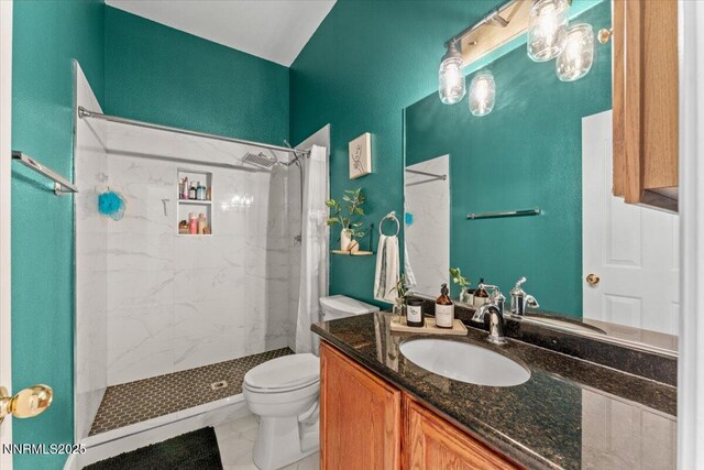 1328 Windridge Dr, Carson City, NV 89706 - full bath featuring vanity, a marble finish shower, and toilet