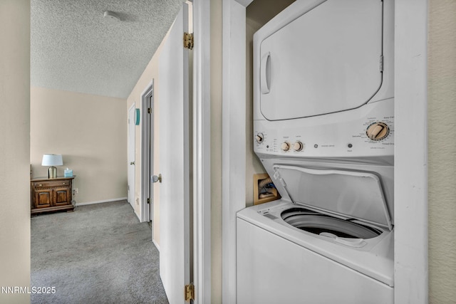 2511 Sycamore Glen Dr Apt 4, Sparks, NV 89434 - washroom with stacked washer / dryer, carpet, a textured ceiling, and baseboards