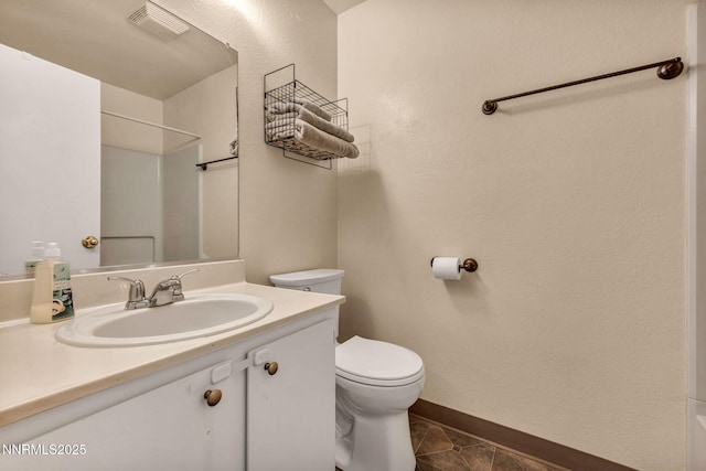 2511 Sycamore Glen Dr Apt 4, Sparks, NV 89434 - bathroom with toilet, vanity, baseboards, tile patterned floors, and a shower