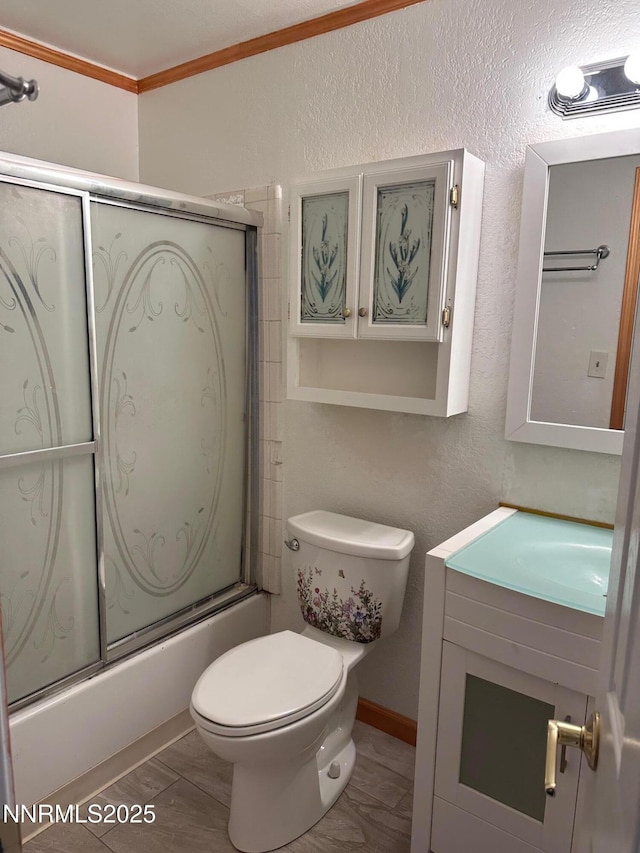 3926 Clear Acre Ln Unit 107, Reno, NV 89512 - full bath featuring vanity, toilet, combined bath / shower with glass door, ornamental molding, and a textured wall