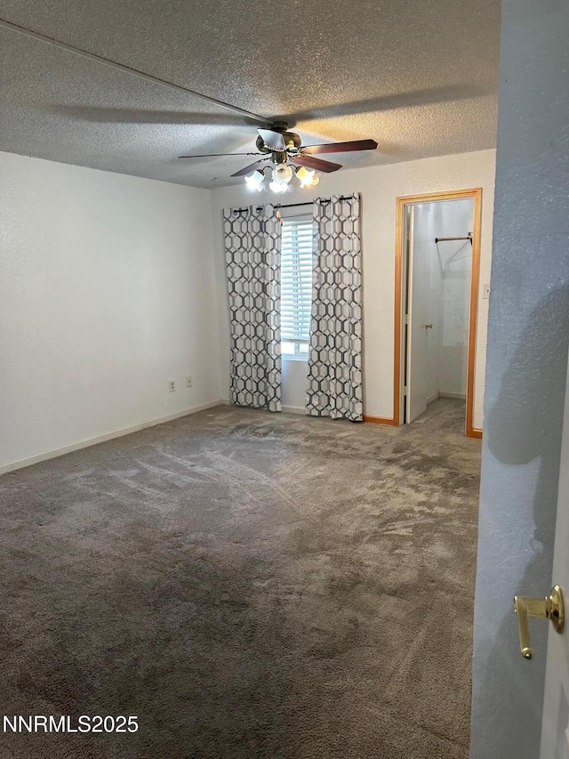 3926 Clear Acre Ln Unit 107, Reno, NV 89512 - spare room featuring carpet floors, a textured ceiling, ceiling fan, and baseboards
