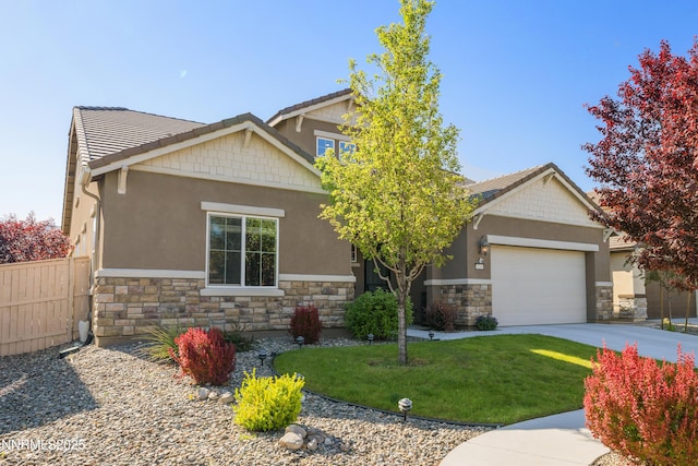 10260 Rollins Dr, Reno, NV 89521 - craftsman-style house with stone siding, an attached garage, driveway, and stucco siding