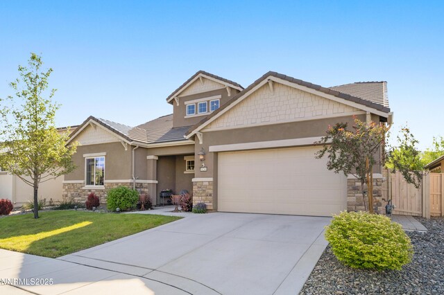 10260 Rollins Dr, Reno, NV 89521 - craftsman inspired home featuring stone siding, an attached garage, stucco siding, driveway, and a tiled roof