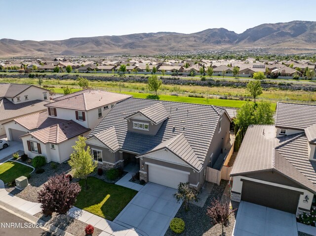 10260 Rollins Dr, Reno, NV 89521 - aerial perspective of suburban area with a mountainous background