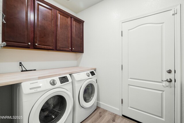 10260 Rollins Dr, Reno, NV 89521 - laundry room with cabinet space, washer and clothes dryer, light wood-type flooring, and baseboards