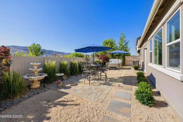10260 Rollins Dr, Reno, NV 89521 - fenced backyard featuring a patio and a mountain view
