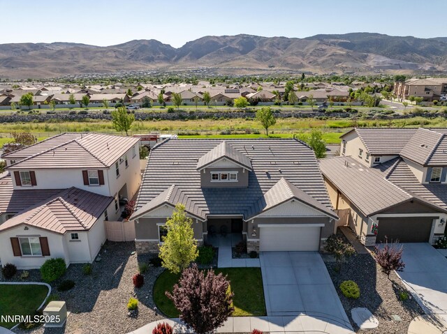 10260 Rollins Dr, Reno, NV 89521 - aerial perspective of suburban area featuring a mountain backdrop