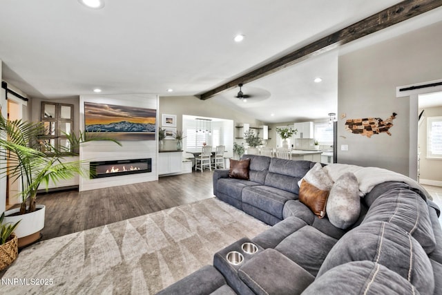 772 Mammoth Way, Gardnerville, NV 89460 - living room with a barn door, wood finished floors, recessed lighting, and a glass covered fireplace