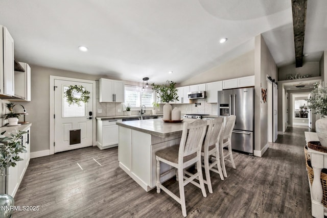 772 Mammoth Way, Gardnerville, NV 89460 - kitchen featuring appliances with stainless steel finishes, backsplash, white cabinetry, dark wood finished floors, and recessed lighting