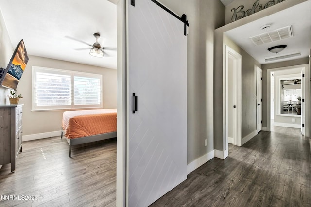 772 Mammoth Way, Gardnerville, NV 89460 - hallway featuring a barn door, dark wood-style flooring, and baseboards