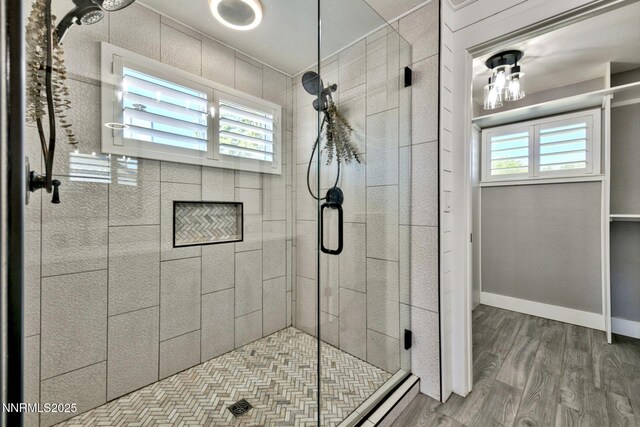 772 Mammoth Way, Gardnerville, NV 89460 - bathroom with healthy amount of natural light, wood finished floors, and a shower stall