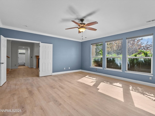 4943 Foxcreek Trl, Reno, NV 89519 - unfurnished room with healthy amount of natural light, ceiling fan, baseboards, ornamental molding, and light wood-style flooring