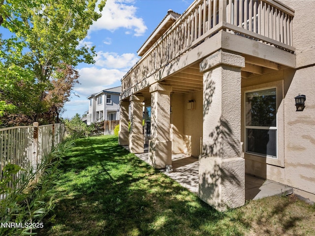 4943 Foxcreek Trl, Reno, NV 89519 - view of property exterior with a balcony, stucco siding, and a patio