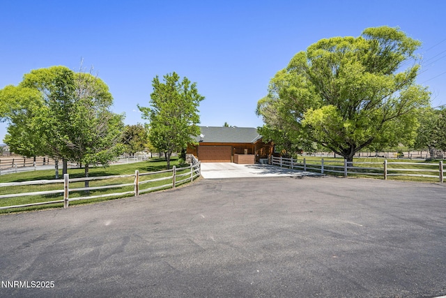 2607 Bowers Rd, Gardnerville, NV 89410 - obstructed view of property featuring driveway and an attached garage