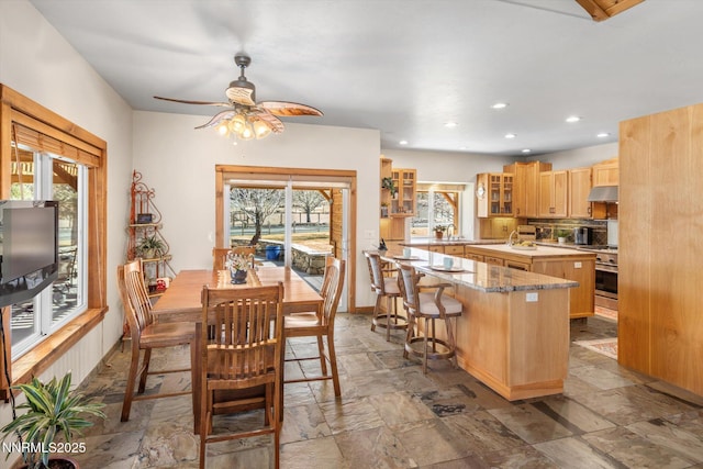 2607 Bowers Rd, Gardnerville, NV 89410 - dining space with stone finish flooring, ceiling fan, recessed lighting, and baseboards