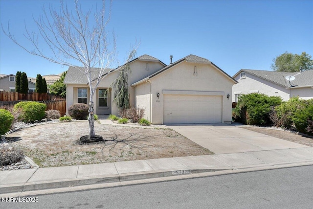5737 Sonora Pass Dr, Sparks, NV 89436 - view of front of property featuring a garage, stucco siding, and driveway