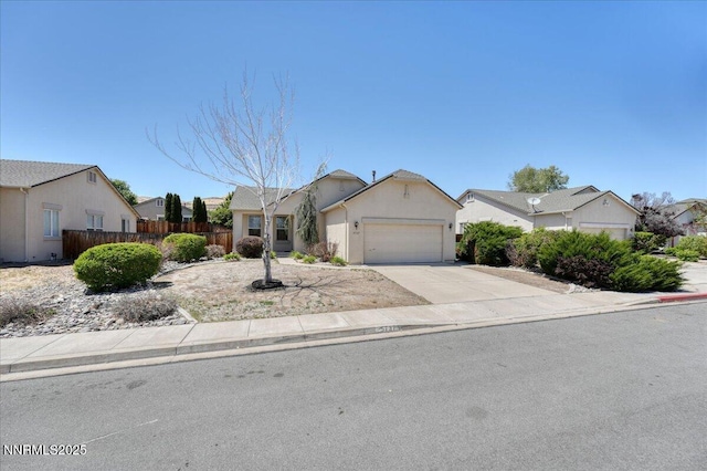 5737 Sonora Pass Dr, Sparks, NV 89436 - view of front of house with an attached garage, a residential view, driveway, and stucco siding