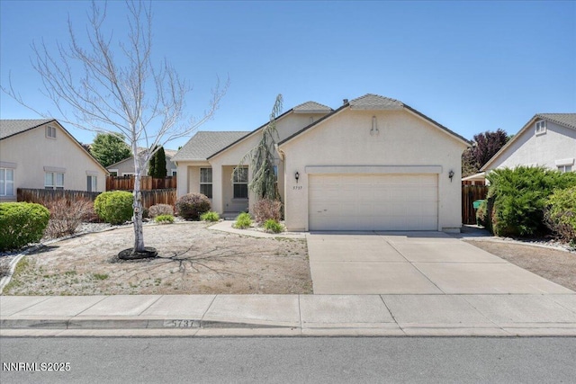 5737 Sonora Pass Dr, Sparks, NV 89436 - view of front facade featuring a garage, driveway, and stucco siding