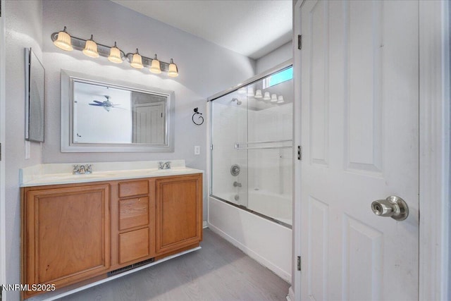 5737 Sonora Pass Dr, Sparks, NV 89436 - bathroom with shower / bath combination with glass door, double vanity, and wood finished floors