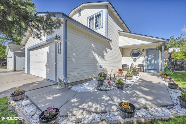 7395 Pah Rah Dr, Sparks, NV 89436 - view of home's exterior with a porch, concrete driveway, and an attached garage