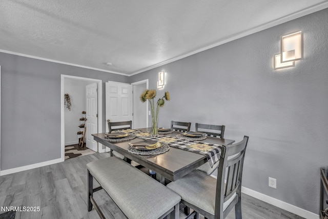 7395 Pah Rah Dr, Sparks, NV 89436 - dining space with wood finished floors, baseboards, and crown molding