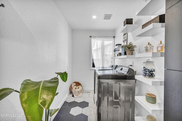 7395 Pah Rah Dr, Sparks, NV 89436 - laundry area featuring independent washer and dryer, baseboards, recessed lighting, and tile patterned floors