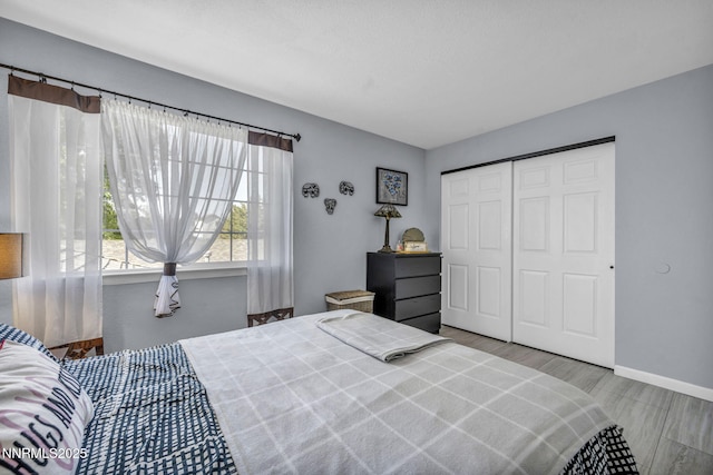 7395 Pah Rah Dr, Sparks, NV 89436 - bedroom with wood finished floors, a closet, and baseboards